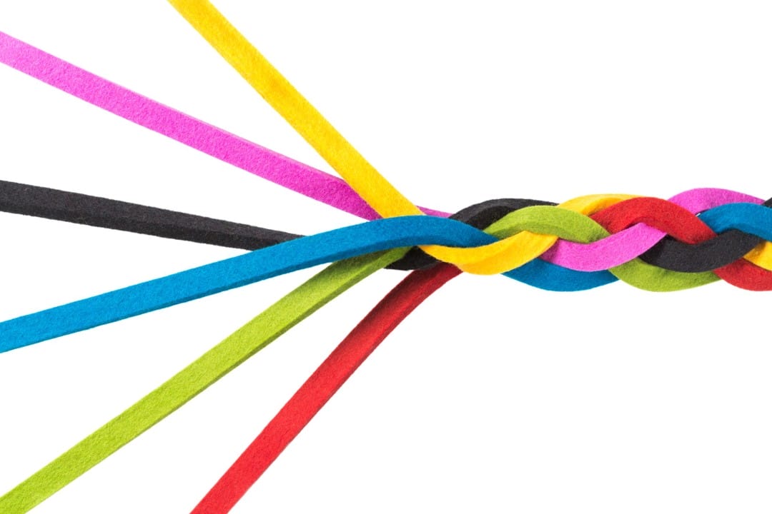 Colourful-loom-braid A colorful braided loom band made of elastic strands.