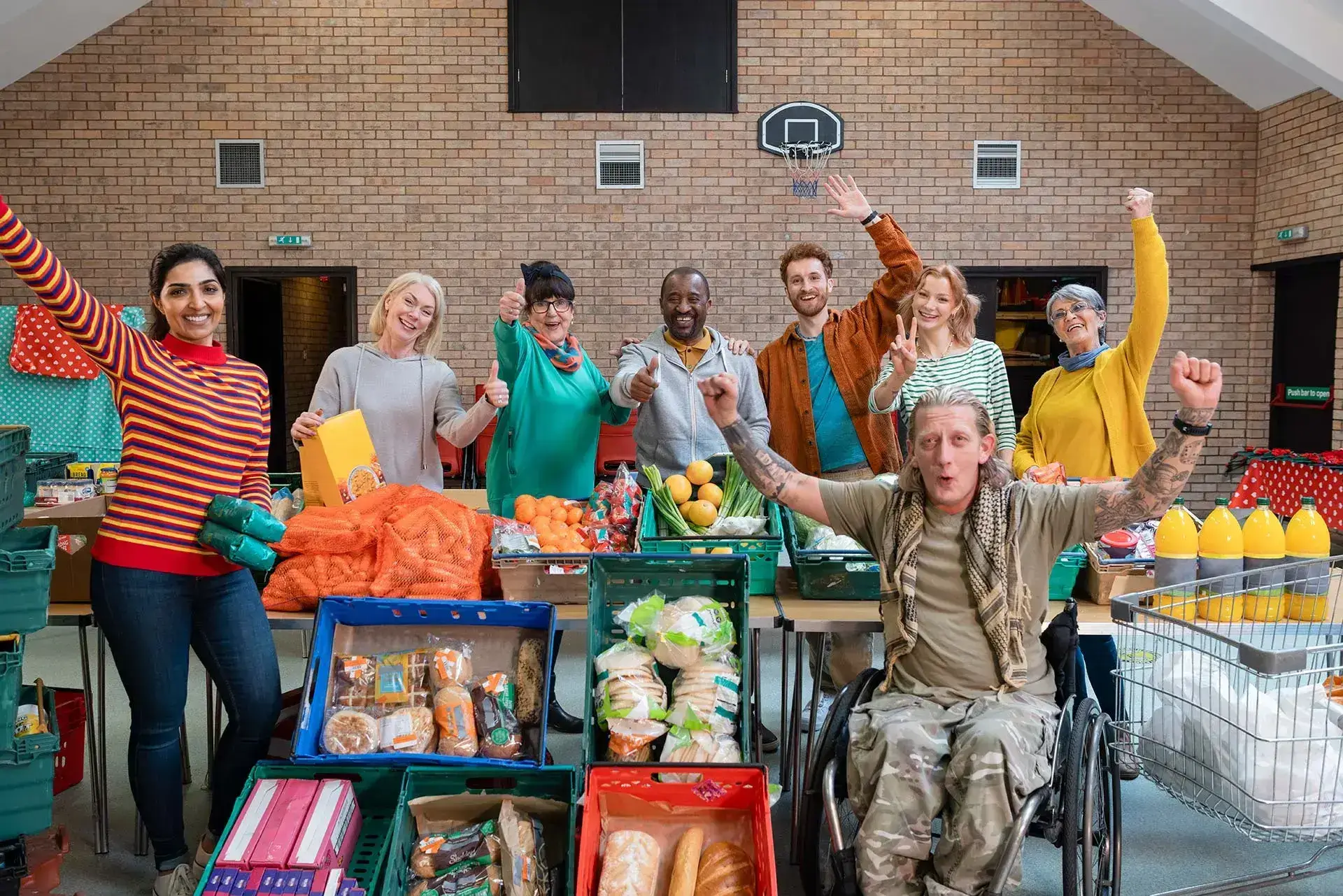 group-photo-of-team-creating-food-bank Team photo during food bank initiative, reflecting grassroots collaboration and community-led responses to disadvantage.