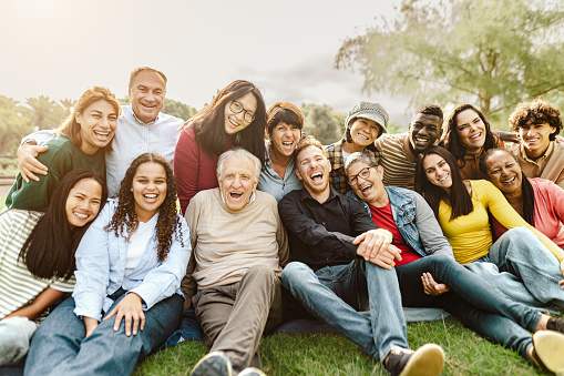 group-photo-taken-outside-showing-smiles Outdoor group photo of smiling participants, showcasing engagement, collaboration, and community spirit.